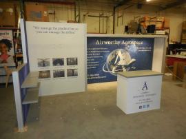 Custom Inline Exhibit with Shelves, Monitor Mount, Graphics, Full-size Closet, and Downlighting -- Image 3