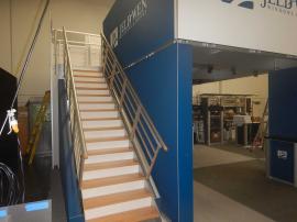 RENTAL: RE-9020 Medium Deck with Angled Staircase Graphic Frames and Sintra Stair Risers.