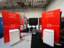 RENTAL: (4) 4 x 8 Double-Sided Lightboxes, (8) RE-1575 Square Workstation Counters, (8) Monitor Mounts, (4) RE-711 Charging Station Tables, (8) RE-170 Literature Shelves, and SEG Backlit Fabric Graphics