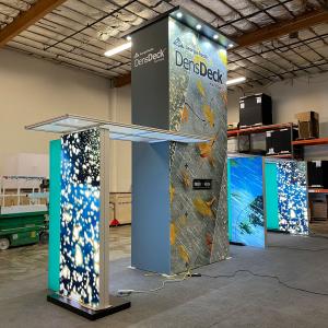 Modified VK-5089 Island Exhibit with 16 ft. Tower with Canopies and Locking Closet, (2) Monitor Mounts, Lightboxes, and Conference Meeting Area