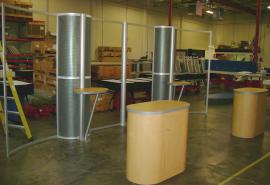 10' x 20' Visionary Designs Exhibits with Perforated Inserts, Oval Counters, and Custom Graphics (missing graphics)