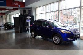 Cell Phone Charging Stations with Dual Monitors and Graphics at Auto Dealership -- Image 2