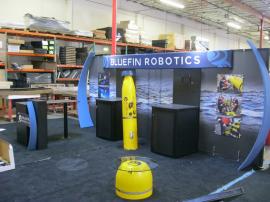 Customized eSmart ECO-2009 with Added Aero Frames, Kiosks, Wire Graphics, and Customized Product Displays -- Image 1