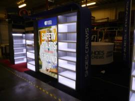 Custom Exhibit with LED Lit Shelving and Backlit SEG Fabric Lightbox