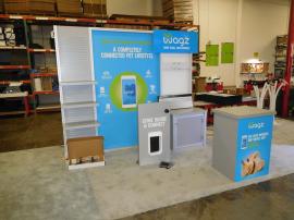 Custom eSmart Exhibit with Shelves, Slatwall, Graphics, Monitor Mount, Locking Storage, Counter, Header, and Custom Doggie Door