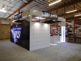 Custom Island Exhibit with Product Shelves, Cabinets, and Storage. Includes LED Accent Lighting, Full-size Closet, SuperNova Lightbox, Vinyl Graphics, and Monitor Mount