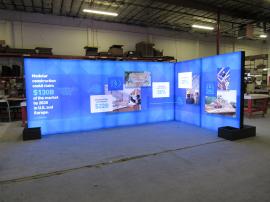 Custom Island Exhibit with SuperNova Lightboxes, SEG Tension Fabric Graphics, Product Shelves, Locking Storage, Monitor Mount, and Planter Boxes