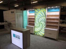 Custom Eco-Systems Modular Inline Exhibit with Multiple LED Lightboxes, Storage Closet, Slant Shelving, Monitor Mount, Slant Shelving, Backlit Reception Counter, (4) MoD01329 iPad Swivel Stands, and (4) Charging Ports