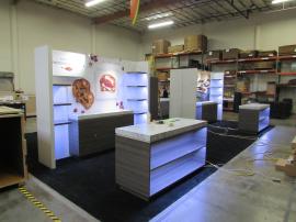 (4) Custom 10 x 10 Exhibits for a 20 x 40 Booth Space with Shelves, Product Counters, Locking Storage, and LED Accent Lights