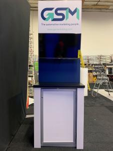 RENTAL: RE-2086 Freestanding Lightbox, (2) Large Monitor Mounts, (2) 55" Monitors, (2) Double-Sided Kiosks with (4) Monitor Mounts, (2) RE-1227 Workstation Counters, (4) 32" Monitors, (1) 48" Wide x 86" High Double-Sided Lightbox, RE-1205 Large Curved Rec