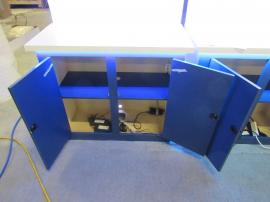 Modified VK-5149 Island Exhibit with (4) Lightbox Towers with Attached Counters and Locking Storage, Custom Counter with Halo Frame, and Large Two-sided Halo Lightbox