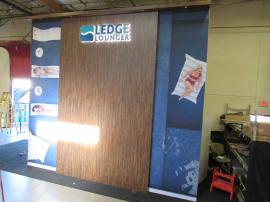 Double-sided 16 ft. High Wall with Laminate and SEG Fabric Graphics and Large Interior Closet