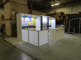 VK-4025 Custom Modular Exhibit with Shelves, Puck Lights, Fabric Graphics, Custom Parsons Counter, and Locking Storage Closet