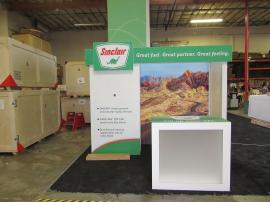 Custom Inline Exhibit with Lightboxes, Wraparound Headers, Monitor Mount, and Custom Wood Counter with Branding