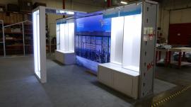 Custom Inline Exhibit with Backlit LED Lightbox, Fabric Graphics, Product Kiosks, Locking Storage and Edgelit Product Display