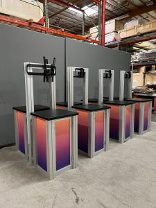 RENTAL: (4) RE-1257 Double-Sided Square Pedestal Kiosks with Locking Doors, Internal Shelves, 6 Ft Uprights, Small Medium Monitor Mounts, and Direct Print Sintra Graphics.