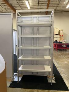 Custom Inline Exhibit with Shelves, Hooks, Fabric Graphics, Monitor Mount, and Freestanding Shelving Display