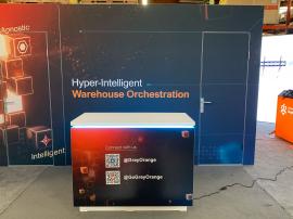 RENTAL: Island Design with Gravitee Conference Rooms/Storage Closet with Locking Doors, (2) 4 ft. Wide x 8 ft. High Double-Sided Lightboxes, (2) Angled Touchscreen Backlit Single-Sided Lightbox Kiosks, (8) Large Monitor Mounts, 75" Monitor with HDMI Cable