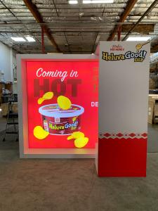 RENTAL: Modified RE-1081 Inline Design with Recessed Single-Sided Lightbox with Fabric Blocker Panel, Framed White Laminate Finish, Gravitee Arch Canopy, Storage Box with White Laminate Finish, SEG Backlit and Non-Backlit Fabric Graphics