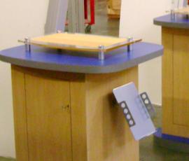 Workstations Include Litature Rack, Locking Door, and Stand-Off Plex Top